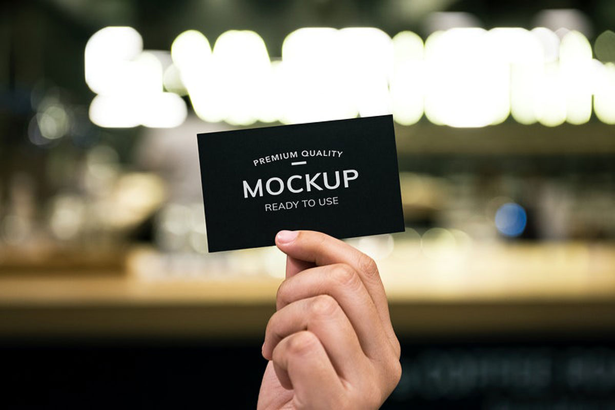 Closeup-of-hand-holding-black-paper-card---295932