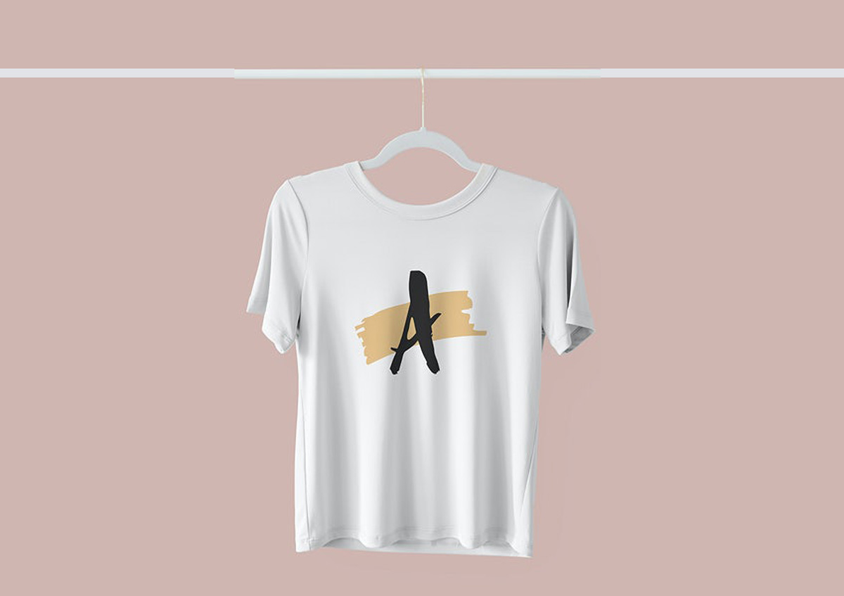 White t shirt mockup hanging on a clothing rack 2281544