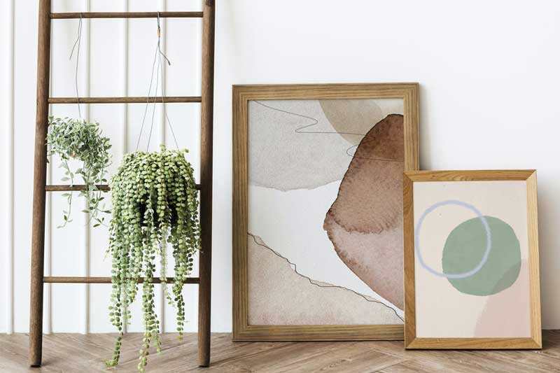 Wooden ladder by frame mockups on the floor